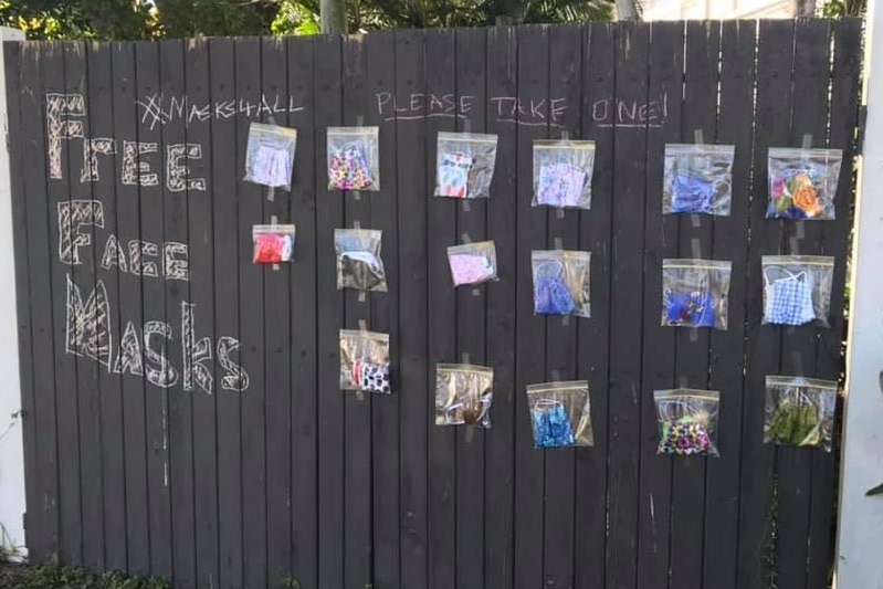 A fence filled with face masks for free.