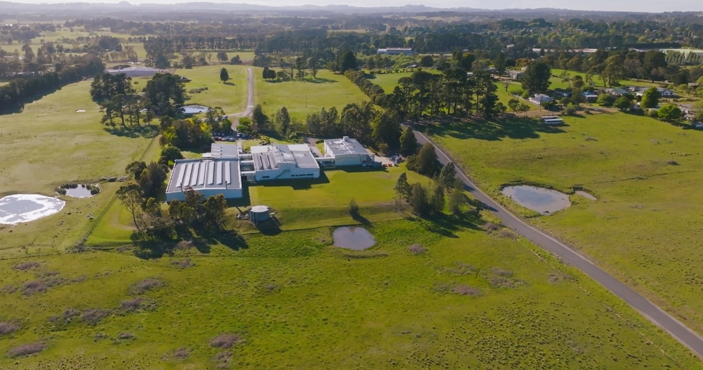 An aerial shot of an industrial facility in a country area.