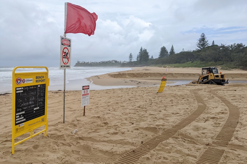 Beach with closed signs