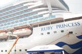 a cruise ship with the name ruby princess on the side