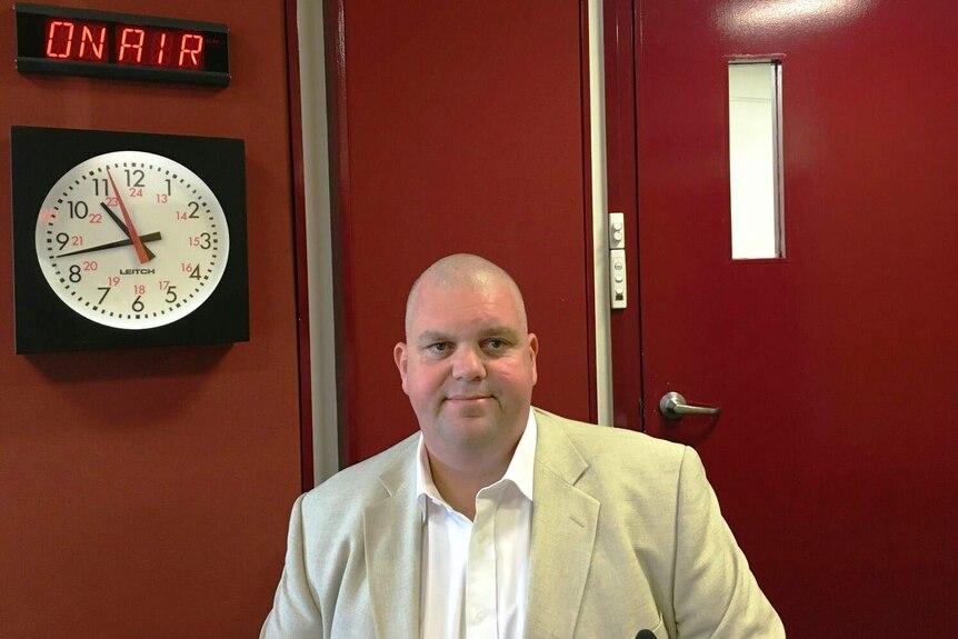 Nathan Tinkler in a radio studio