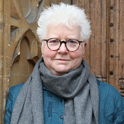 A woman in her 60s with dark glasses and short white hair, the writer Val McDermid