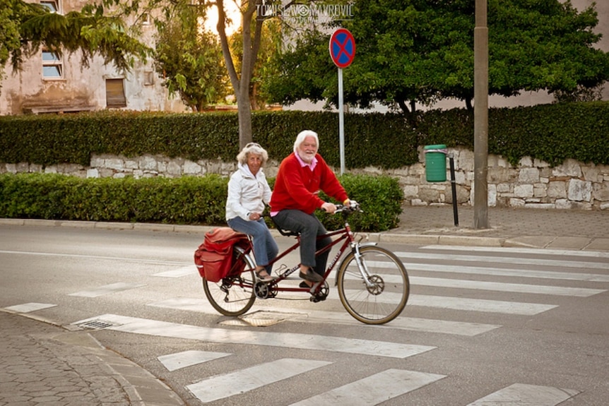 An old couple cycling