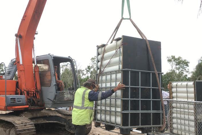 Specially designed pods with metre-long crocs inside being unloaded