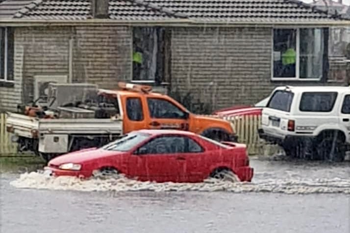 A car drives through water in Ulverstone