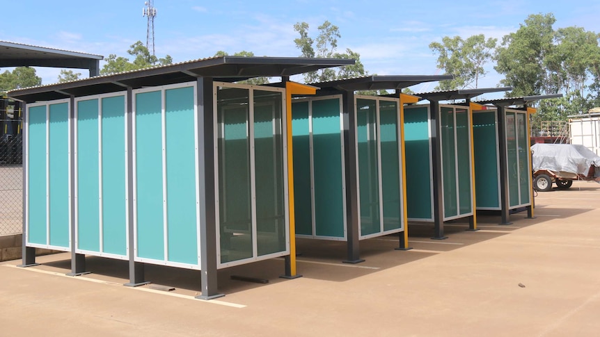 The four bus shelters stand next to each other