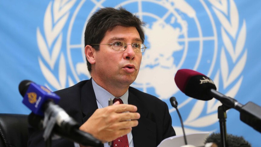 Francois Crepeau, United Nation special rapporteur on the human rights of migrants, speaks into a microphone.