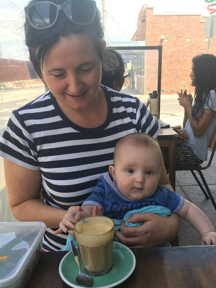 A phot of Liz Trevaskis and her baby son Archie at a cafe.