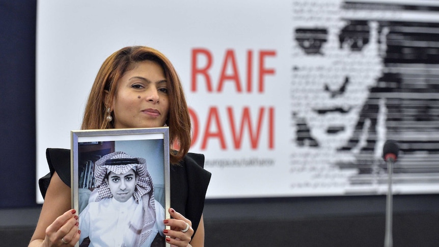 Ensaf Haidar holds a picture of her husband Raif Badawi.