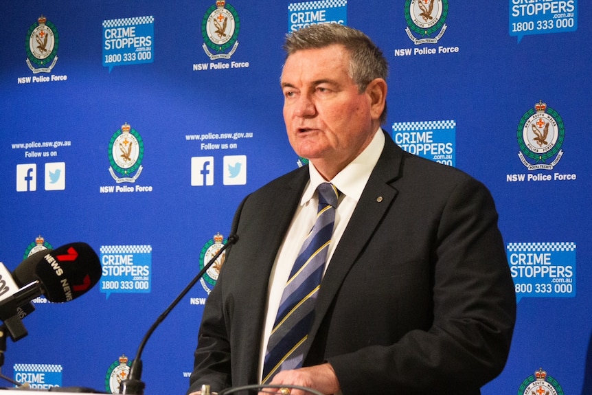NSW Police Homicide Commander Danny Doherty in a black blazer and striped tie