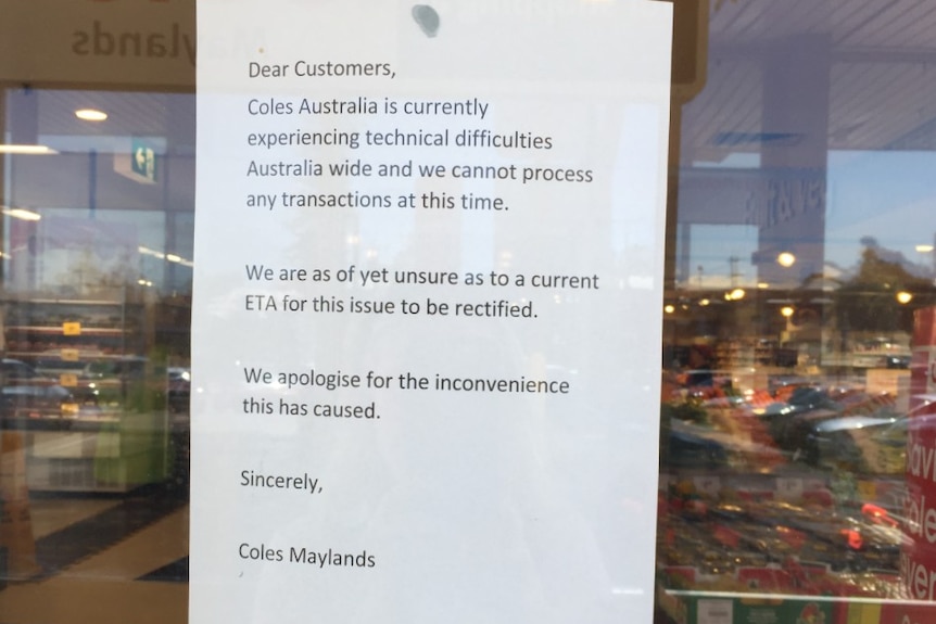 A sign at a Coles store says the shop cannot process any transactions due to technical difficulties.