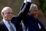 Nelson Mandela and former South African  President FW de Klerk hold their hands high