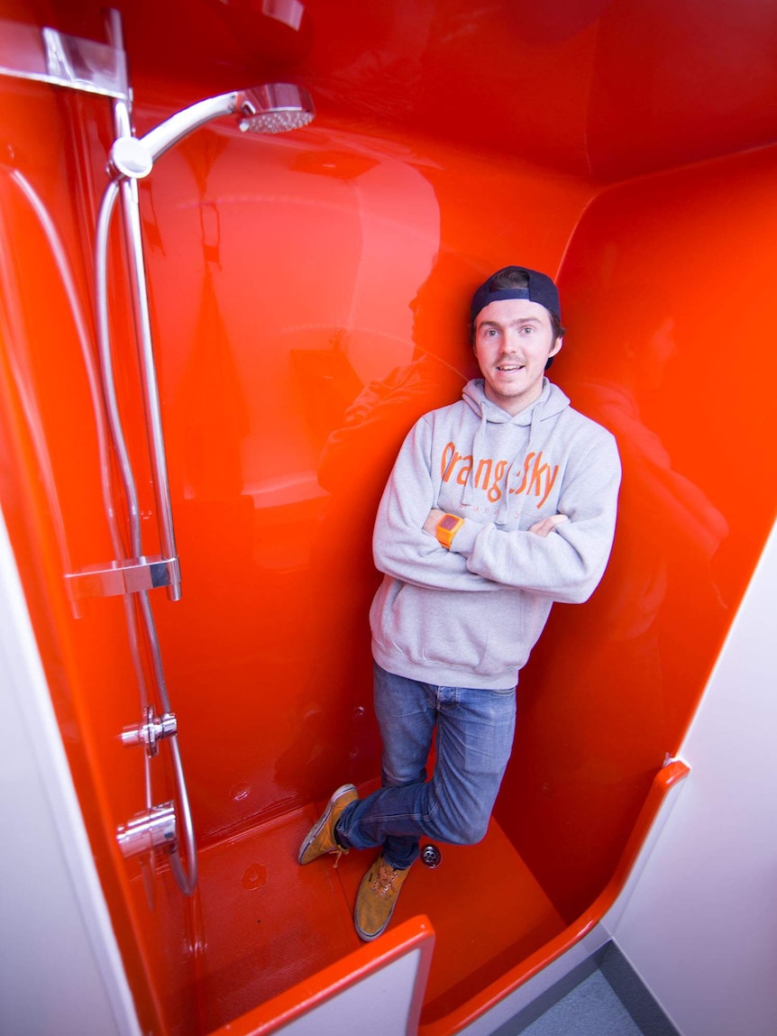 Nic Marchesi inside the mobile shower cubicle