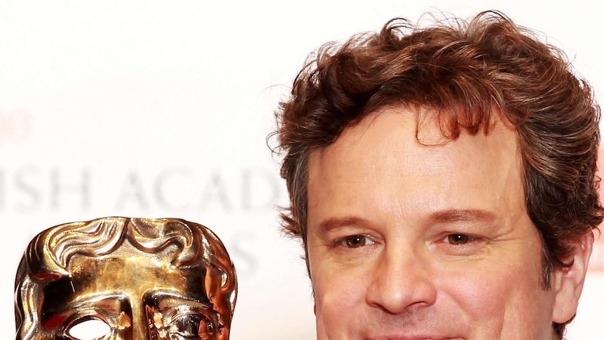 Actor Colin Firth poses with his BAFTA