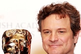 Actor Colin Firth poses with his BAFTA