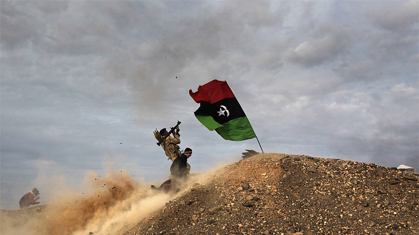 Rebels fire a rocket-propelled grenade at a Libyan air force fighter jet on March 10, 2011 in Ras Lanuf, Libya.