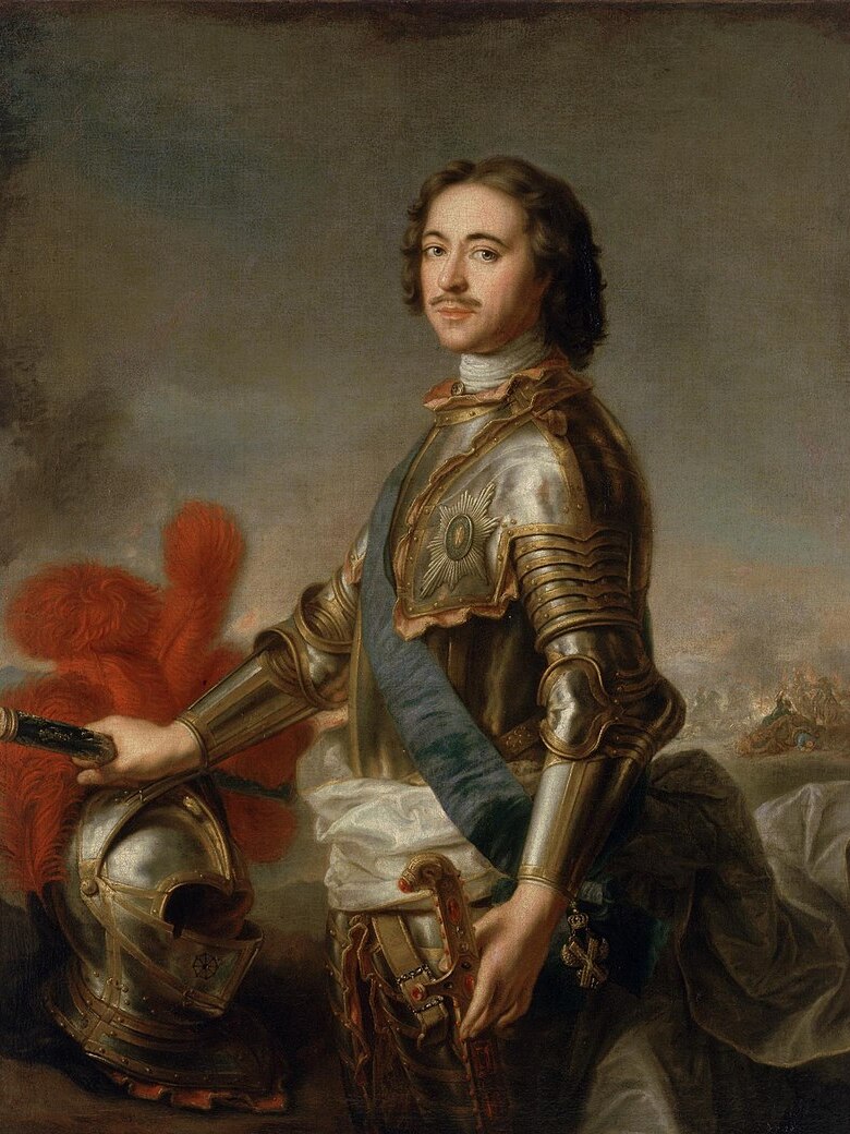 A portrait of Peter the Great shows a handsome, curly-haired man standing with in military uniform with his helmet off