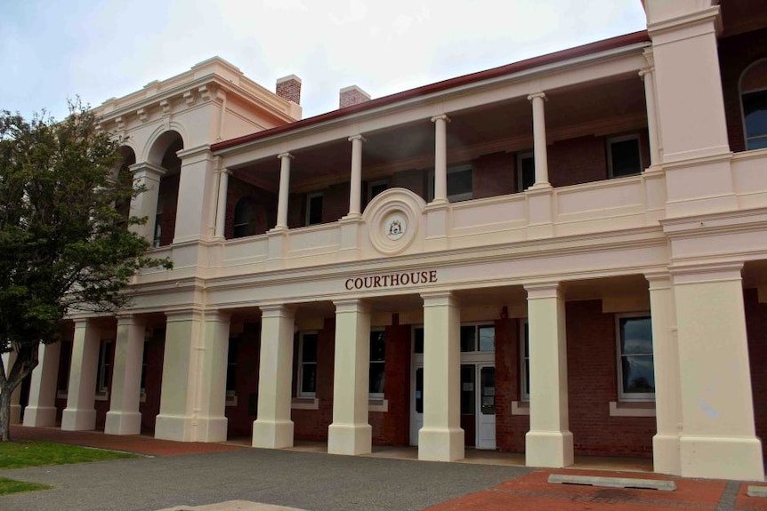 photo of front exterior of historic two storey, Geraldton Court with columns