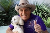 Molly Meldrum poses with his dog Ziggy