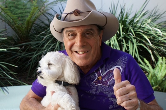 Molly Meldrum poses with his dog Ziggy