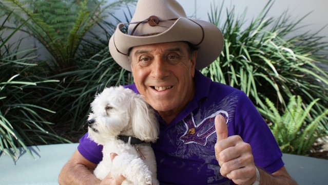 Molly Meldrum poses with his dog Ziggy