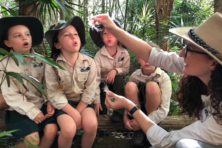 A group of students in the bush at the Nature School Primary.