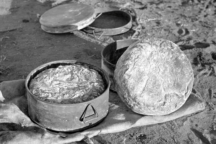 Black and white photo of food in a container.