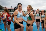 Friendly rivalry ... Jana Pittman (L) and Tamsyn Manou embrace after the 4X400m relay final (Scott Barbour: Getty Images)