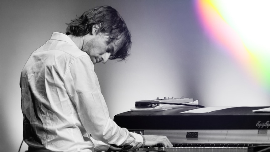 Sean Foran in black-and-white playing Fender Rhodes