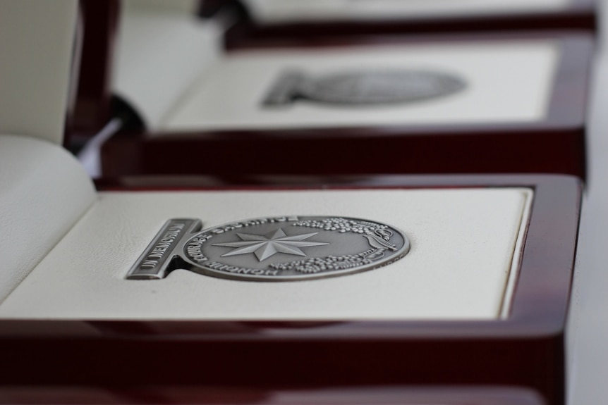 A memorial medallion was presented to each family of the emergency services and fire personnel honoured at the first national memorial service.