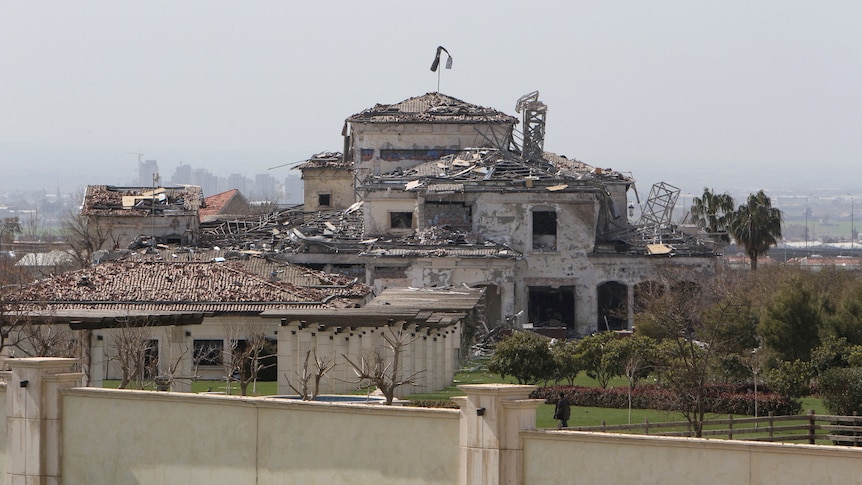 View of a damaged building in the aftermath of missile attacks.