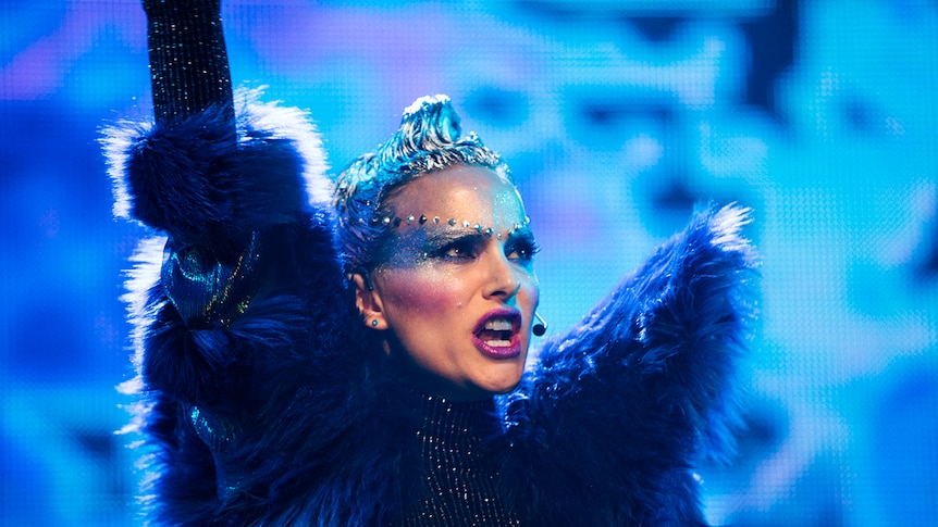 Colour close-up of Natalie Portman performing on stage in 2018 film Vox Lux