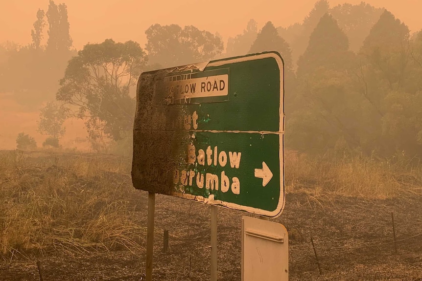 A burnt sign says "Batlow".