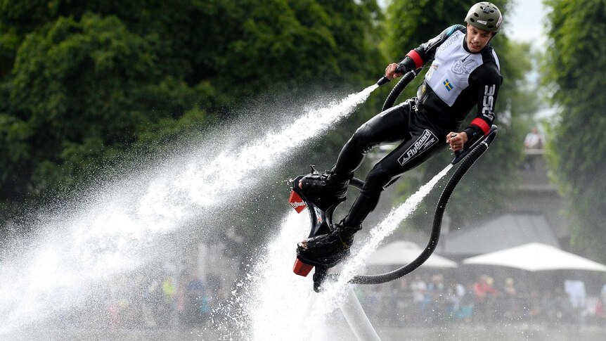 A man gets airborne using a flyboard.