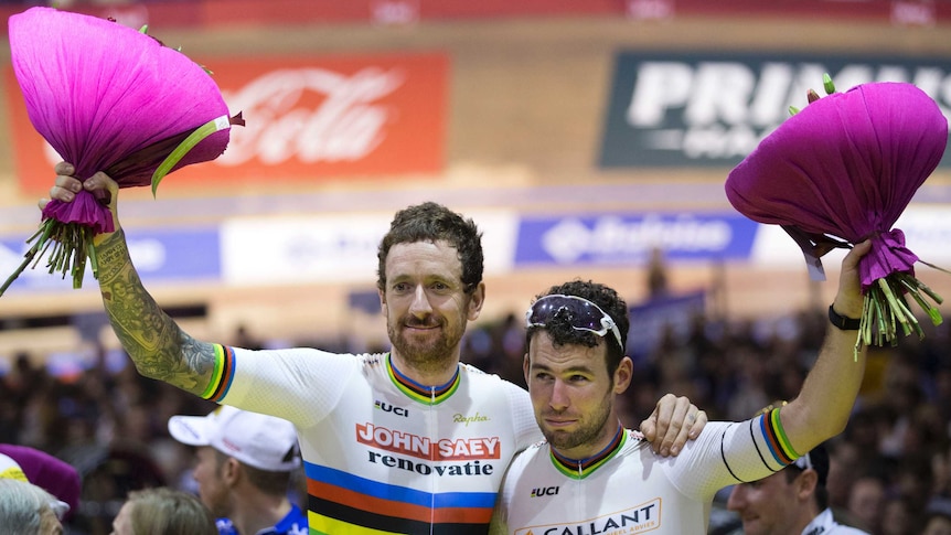 British cyclists Bradley Wiggins (L), and Mark Cavendish celebrate a win in Ghent Six Days event.