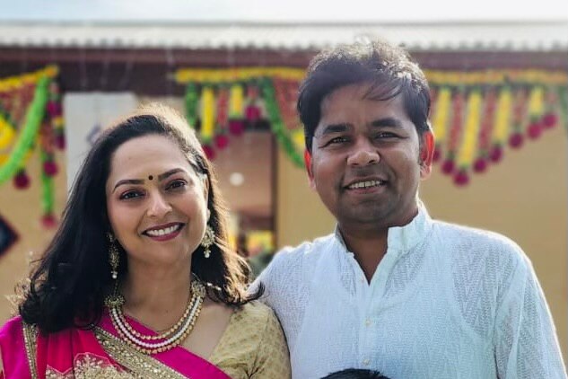 Khyati in a sari with her husband