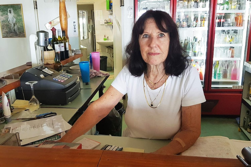 Pat Cowley stands at the reception counter of Gatakers Landing Restaurant at Point Vernon in Hervey Bay.