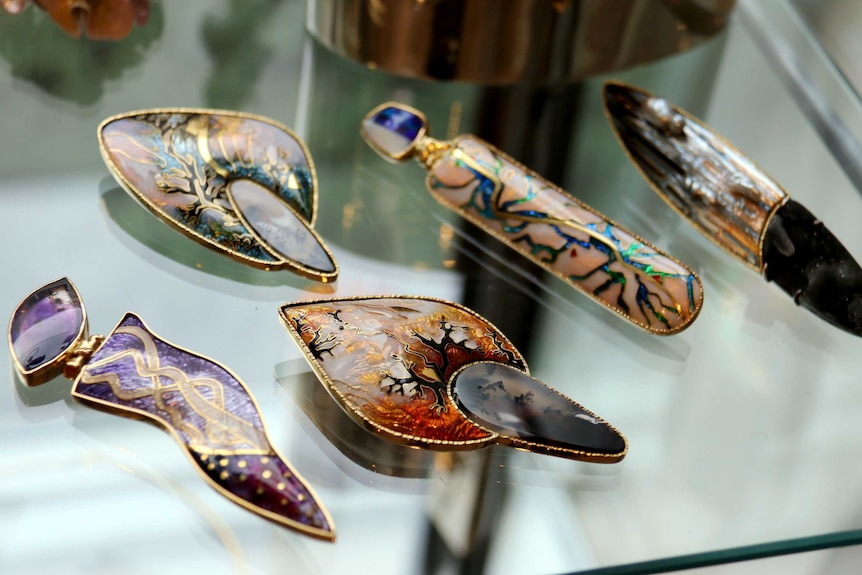 Examples of enameled jewellery by Debbie Sheezel
