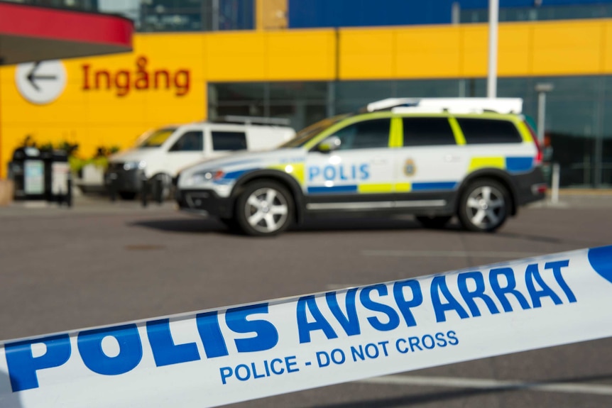 Police cars parked outside an IKEA store