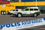 Police cars parked outside an IKEA store