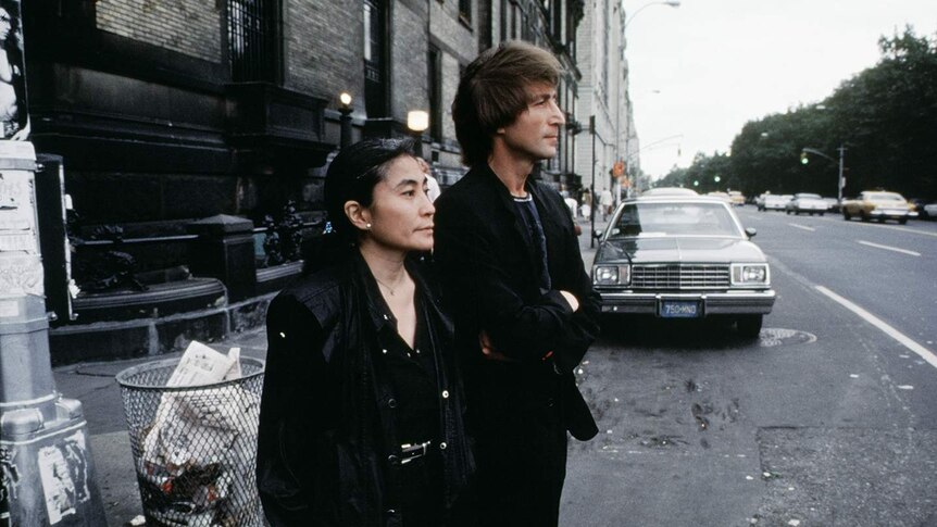 Yoko Ono and John Lennon stand on a street in New York City