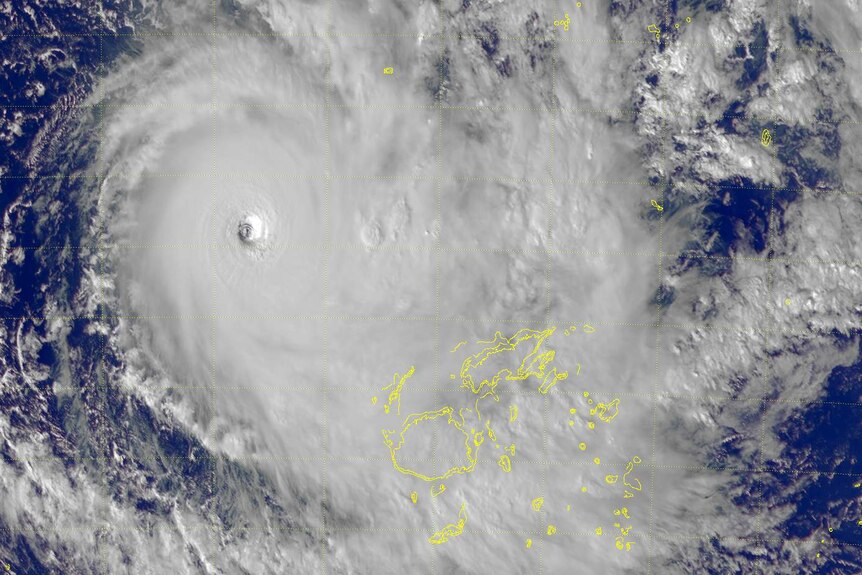 A satellite image of Cyclone Yasa, with the yellow boundaries of Fiji pictured near its eye.