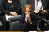 Julia Gillard listens during Question Time in the House of Representatives on August 25, 2011.