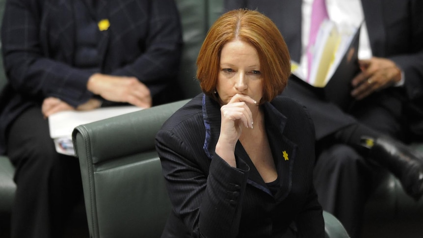 Julia Gillard listens during Question Time in the House of Representatives on August 25, 2011.