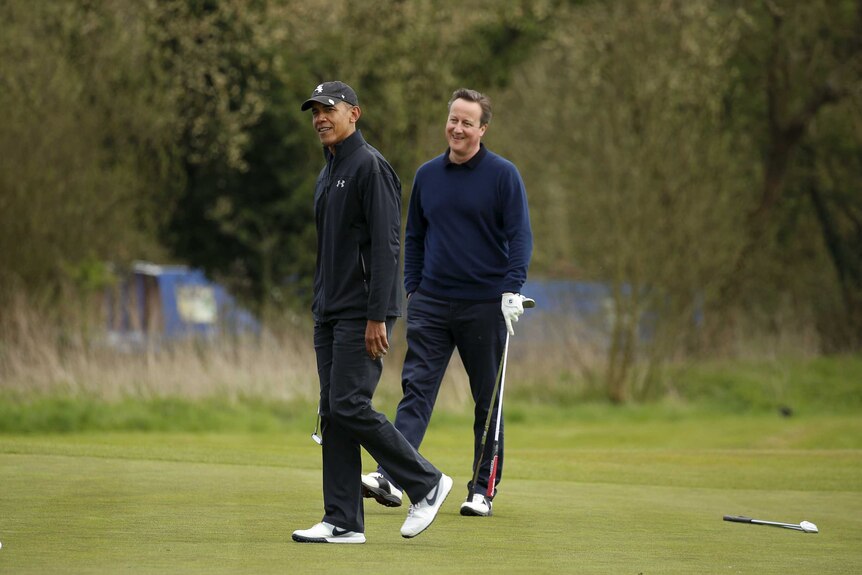 Mr Obama and former British prime minister David Cameron smile on the golf course