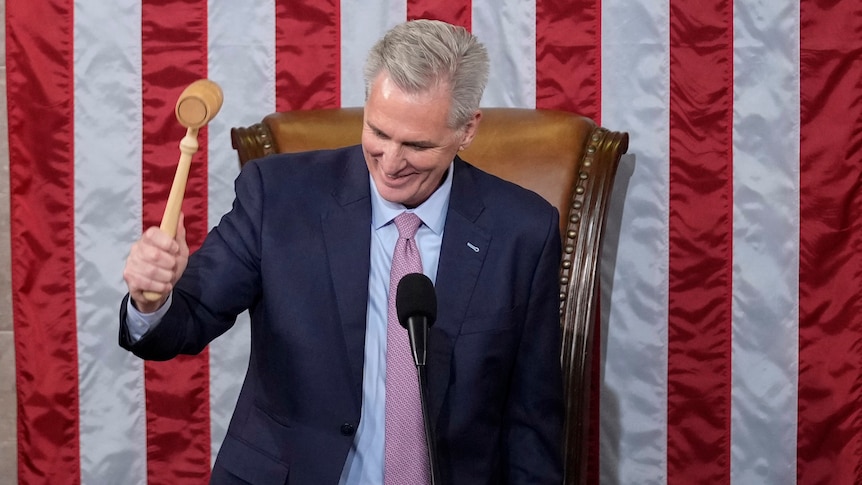 Kevin McCarthy bangs the gavel in front of an American flag. 