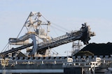 Coal is loaded onto ships.