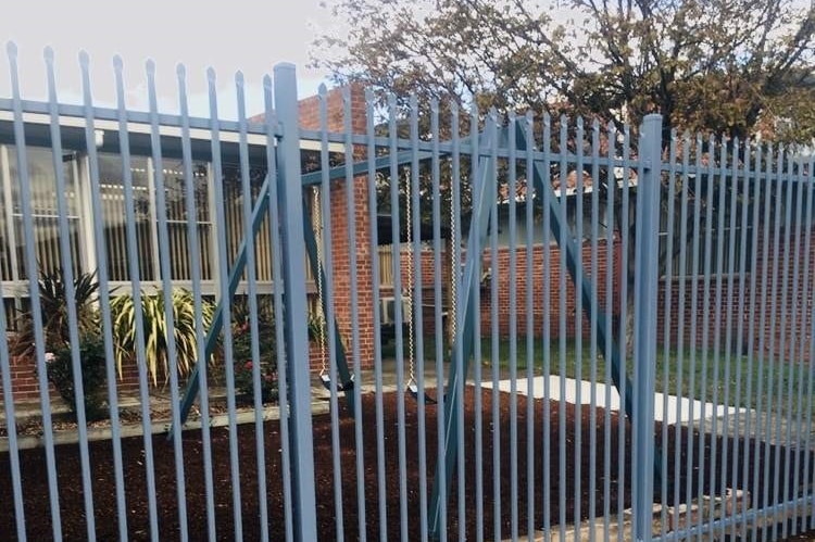 Fenced play area at a Hobart high school.