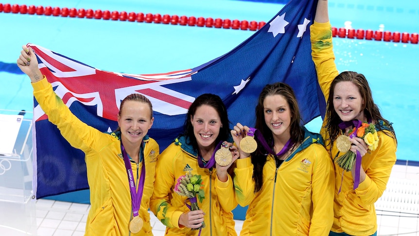 Melanie Schlanger, Alicia Coutts, Brittany Elmslie and Cate Campbell celebrate with their gold medals.