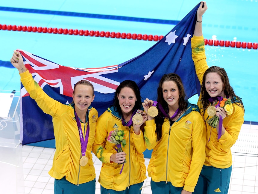 Melanie Schlanger, Alicia Coutts, Brittany Elmslie and Cate Campbell celebrate with gold medals.